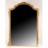 A 19th Century giltwood and gesso pier glass, the broken arch top frame with a ribbon-tie surmount,