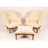 A pair of upholstered armchairs and matching stool on turned and fluted legs CONDITION
