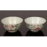 A pair of Chinese famille rose bowls, 20th Century, with lotus and lotus leaves motifs,