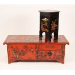 An Indonesian red lacquer chest with incised reserves of flowers and birds within shaped borders