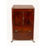 A Regency mahogany cabinet with ebonised stringing,