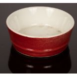 A Chinese monochrome porcelain bowl, Hongyou, 20th Century, in underglaze red, the base is Yubidi,