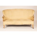 An upholstered settee of Louis XV style with shaped back and giltwood scroll arms on cabriole front