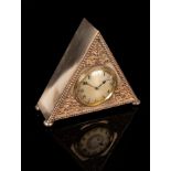 A silver plate cased mantel clock of triangular shape on bun feet, fitted a French movement,