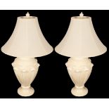 A pair of composition white painted vase-shaped reading lamps with shades,