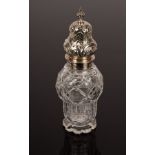 A cut glass sugar caster with silver cover, JTH,