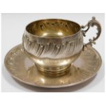 An antique French silver cup & saucer, monogrammed