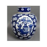 A large 19thC. Chinese blue & white lidded ginger jar with decorative panels & prunus flowers, 10.25
