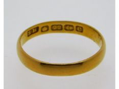 A 22ct gold band, 2.57g, size N/O