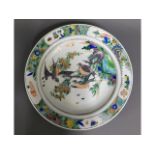 A large Chinese porcelain charger with bird decor,