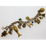 A 9ct gold charm bracelet set with mixed charms in