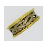 An 18ct two colour gold band, 8.4g, size N/O