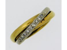 An 18ct two colour gold ring set with nine small d