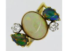 An 18ct gold ring set with centre opal of 12.1mm x