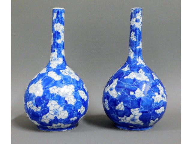 A pair of early 20thC. Chinese prunus bottle vases