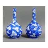 A pair of early 20thC. Chinese prunus bottle vases