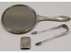 A silver backed vanity mirror, a pair of Edinburgh