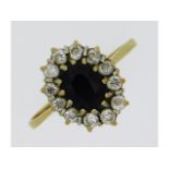 A 9ct gold ring set with sapphire & white stones,