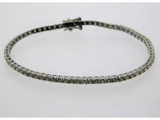 An 18ct white gold line bracelet set with approx.