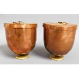 A pair of Victorian brass footed, tin lined lidded copper ice cream coolers stamped Harrods, 4.5in t