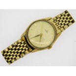 A gents Omega wrist watch with yellow metal case,