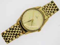 A gents Omega wrist watch with yellow metal case,