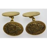 A pair of gold plated silver cufflinks with crest