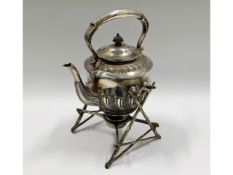 A Victorian silver plated spirit kettle on organic