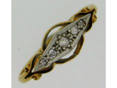 An antique 18ct gold ring set with five small diam