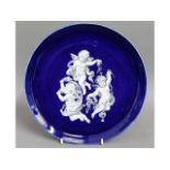 A 19thC. pate sur pate cobalt blue plate, given as