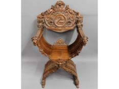 An Italian, 19thC. carved walnut Savonarola chair,