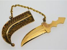 A yellow metal Persian dagger brooch, electronical