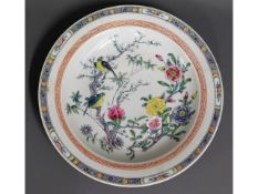 A large Chinese porcelain charger with hand painte