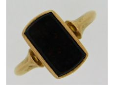 A 9ct gold signet ring set with a 13mm wide blood