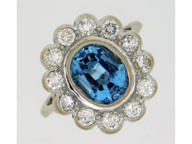 An 18ct white gold ring set with approx. 1.2ct of lively diamonds & approx. 2.55ct aquamarine, with