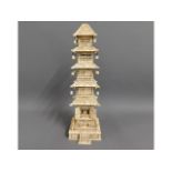 A 19thC. Chinese carved ivory tower with small Bud