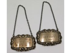 A pair of Sheffield silver decanter labels, whisky