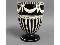 An early 19thC. Wedgwood vase with garland decor,