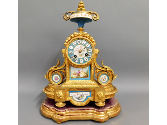 A 19thC. gilt bronze ormolu French clock with Sevr