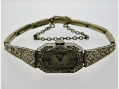 A 1940's ladies platinum cased cocktail watch with