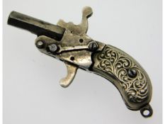 A silver (tested) & base metal miniature charm pistol, complete with firing action, 42mm long, 6.3g