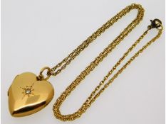 A Victorian 15ct gold heart shaped locket set with small diamond, 25.5mm x 21.75mm, 5.5g, on an 18in