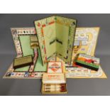 A selection of vintage board games including Monop