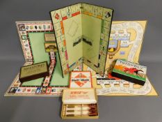 A selection of vintage board games including Monop