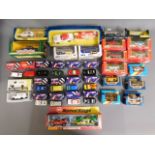 A quantity of mixed boxed diecast toy vehicles inc