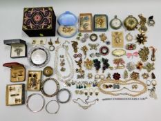 A quantity of costume jewellery including Elvis Pr