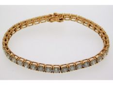 An 18ct rose gold diamond line bracelet, approx.12