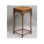 A 19thC. Chinese hardwood stand with carved decor,