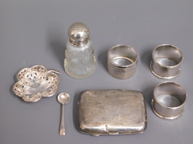 A silver cigarette case, a silver dish, three silv