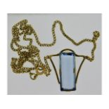 A 9ct gold chain & pendant set with topaz, fault t
